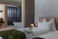 Bühelwirt St. Jakob — modern mountain stay with warm wood interiors, quiet spa spaces, and panoramic valley views.